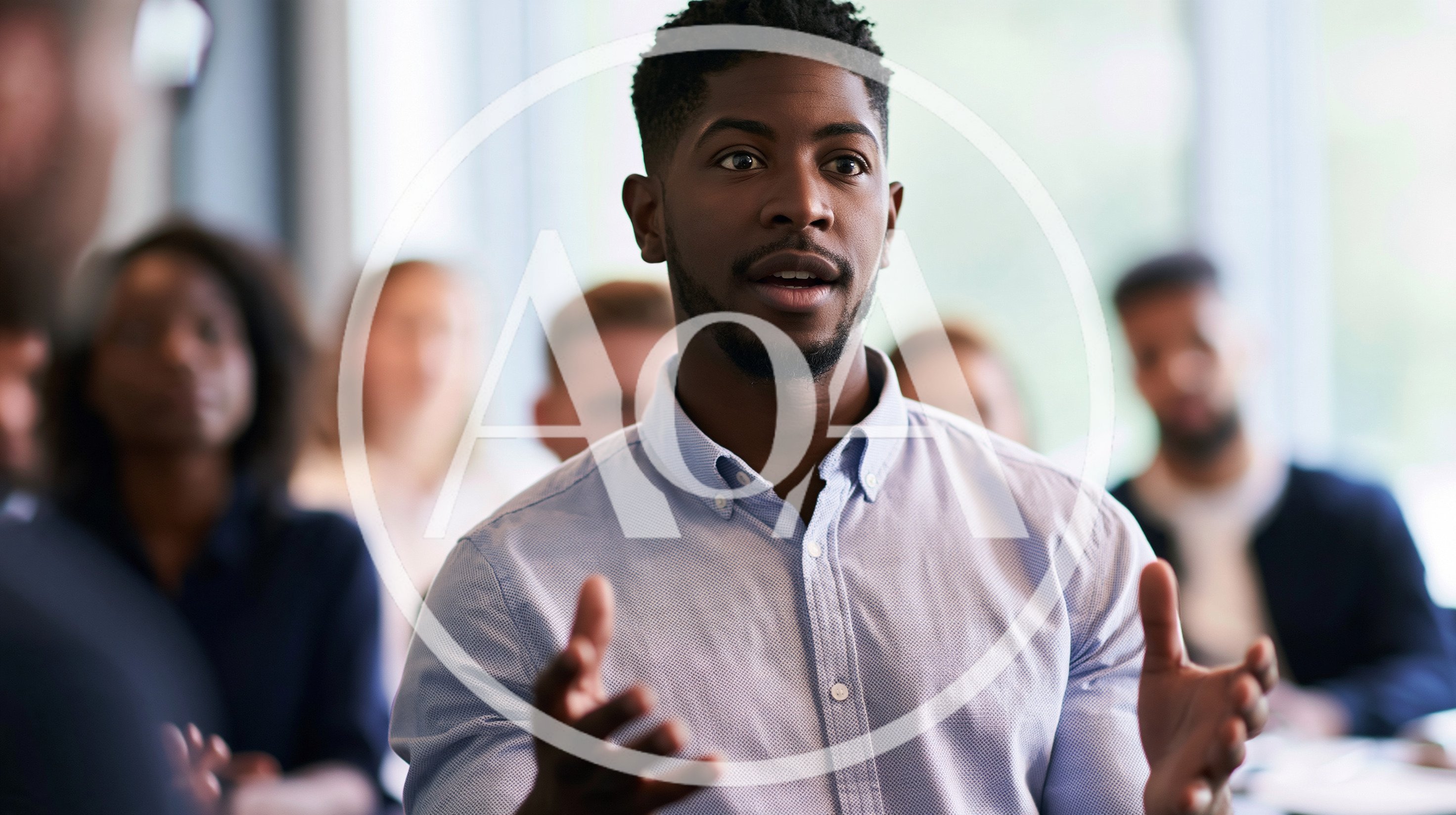 Young Black Man Speaking During A Business Meeting