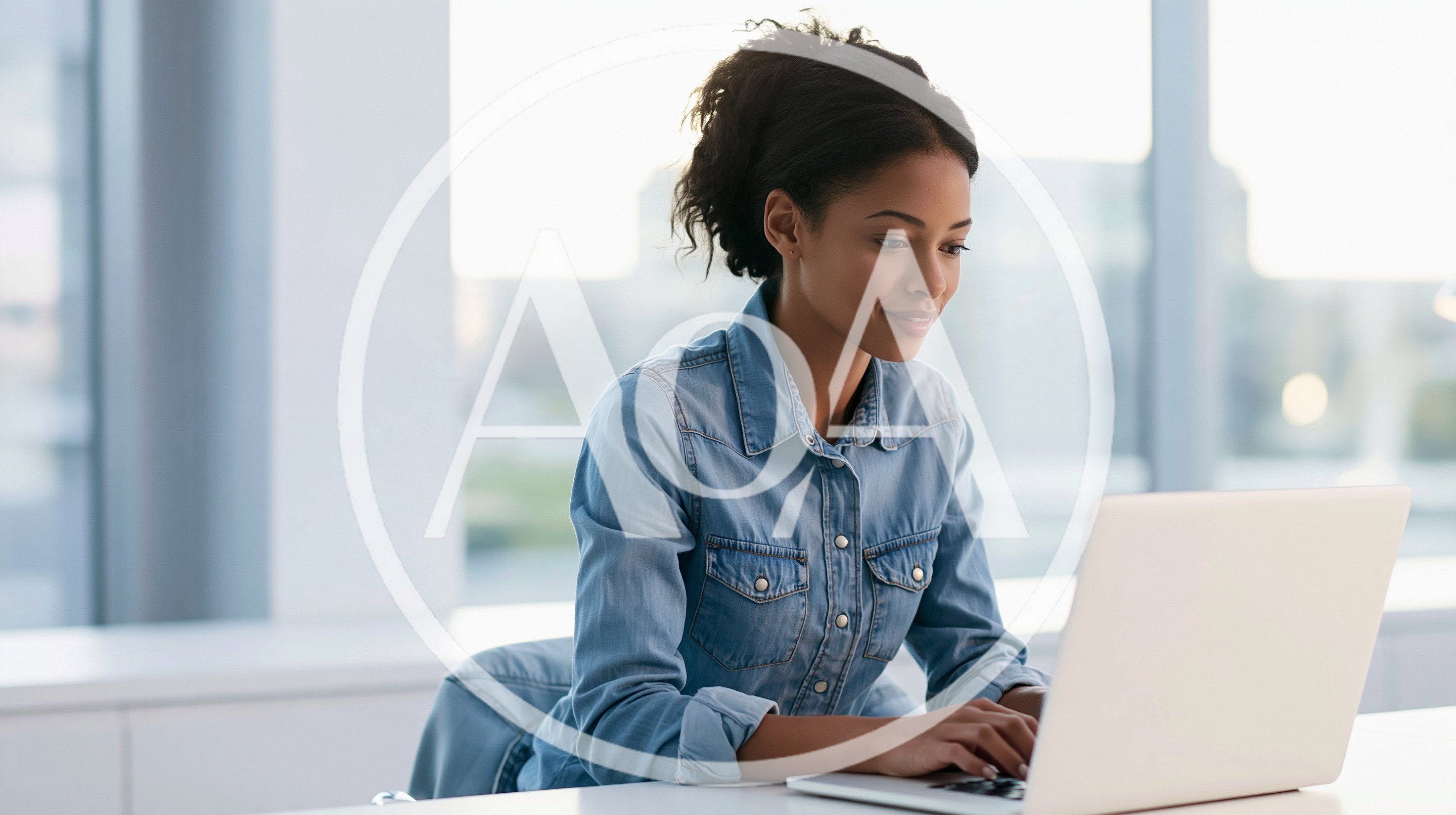 Young Woman Working On Laptop In Modern Office