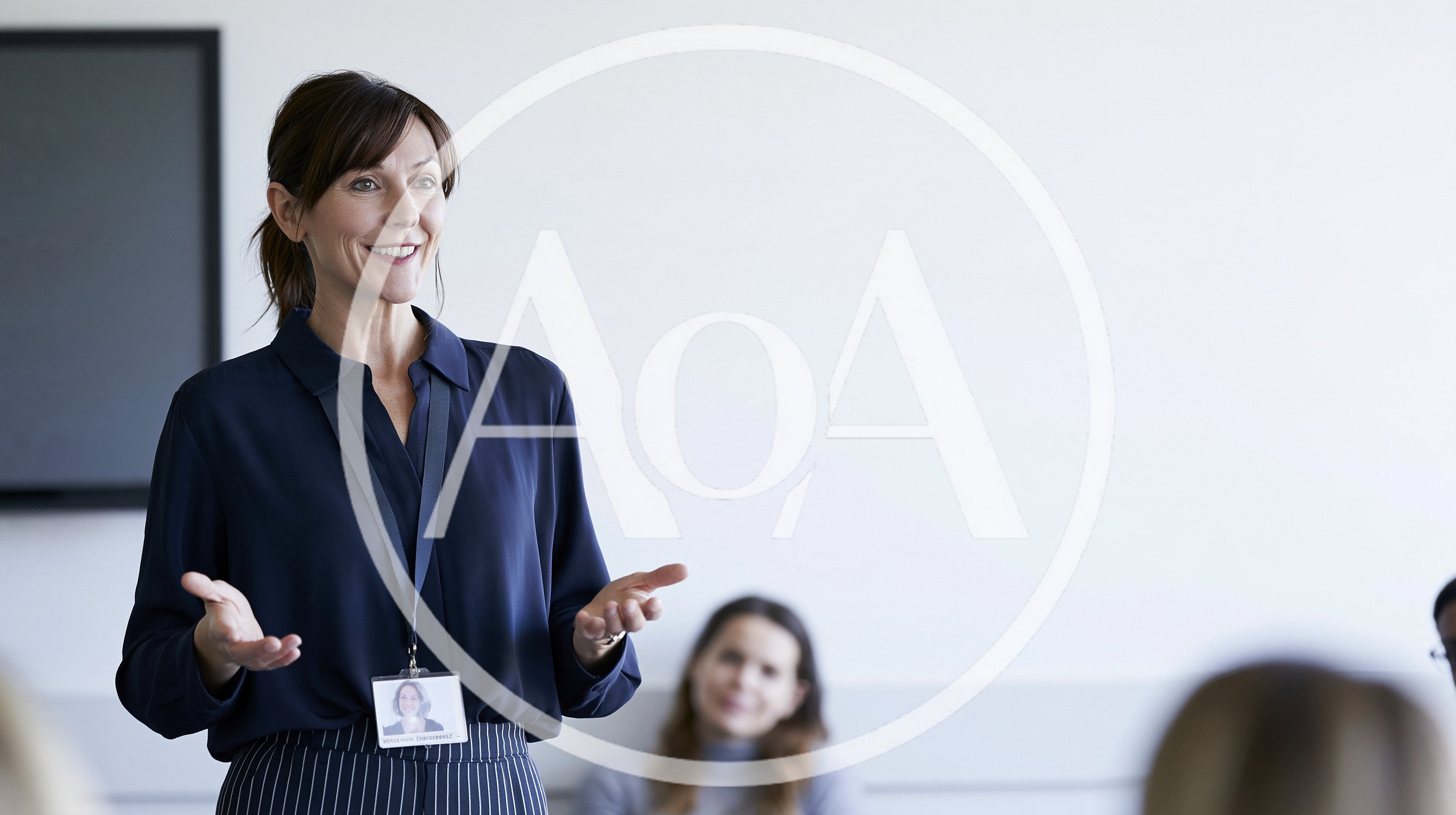 Professional Woman Giving A Presentation In A Meeting