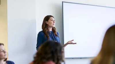Professional Woman Giving A Presentation In A Meeting