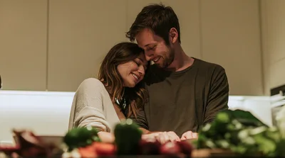 Happy Couple Preparing Healthy Meal Together In Kitchen