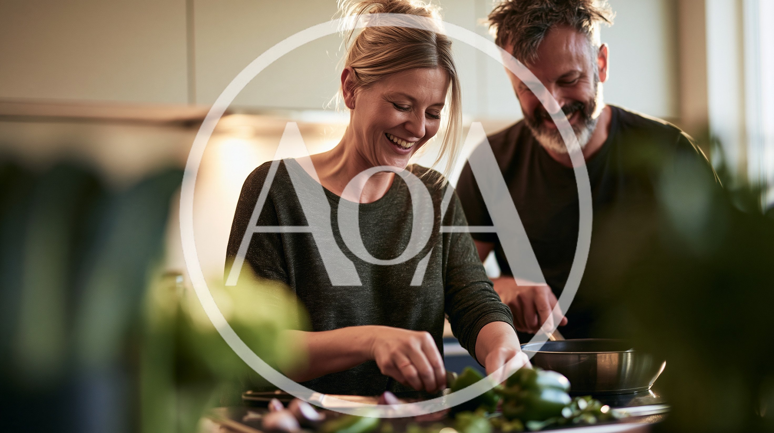 Happy Couple Cooking Together In A Modern Kitchen