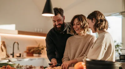 Friends Cooking Together In A Modern Kitchen