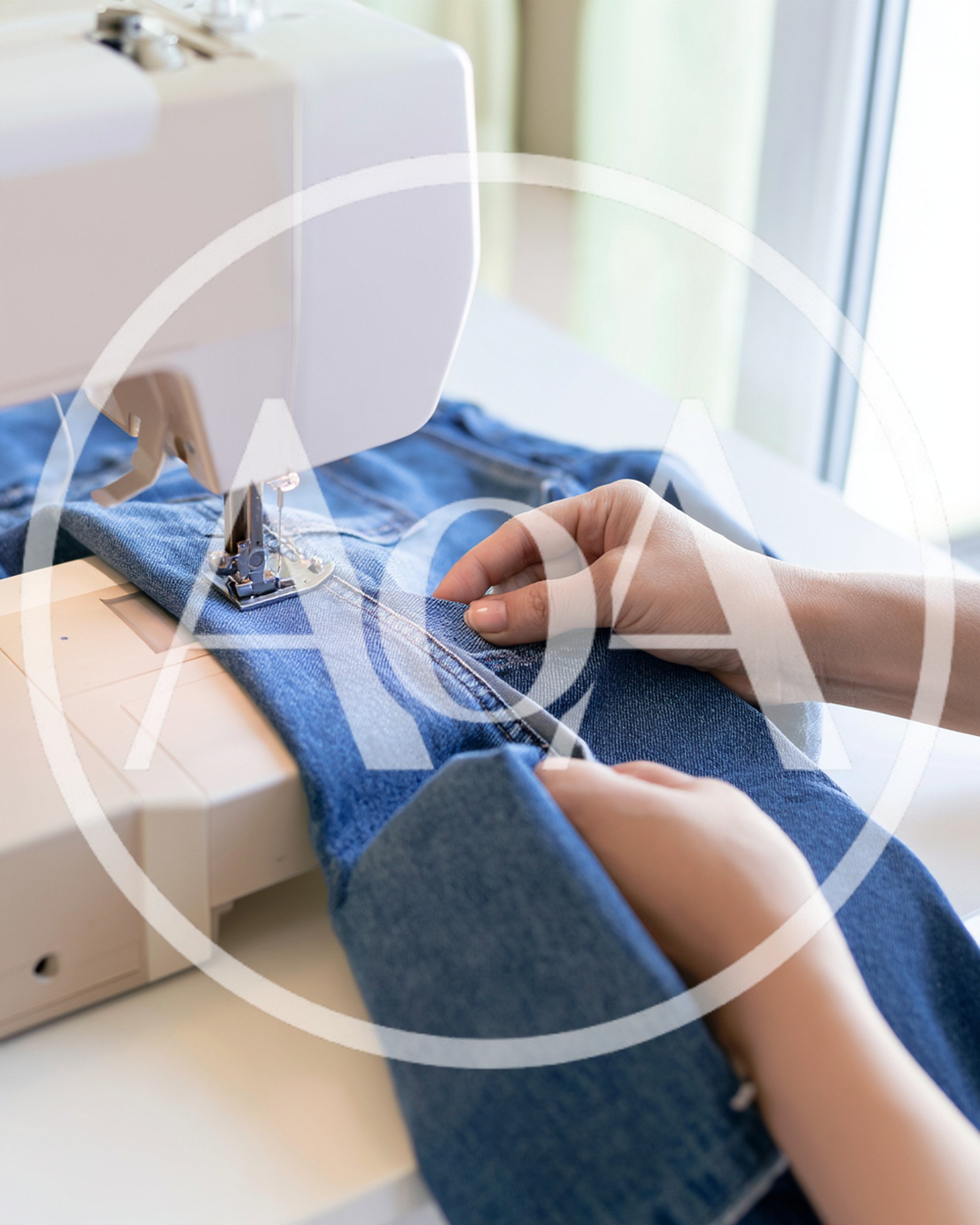 Person Sewing Denim Fabric With A Sewing Machine