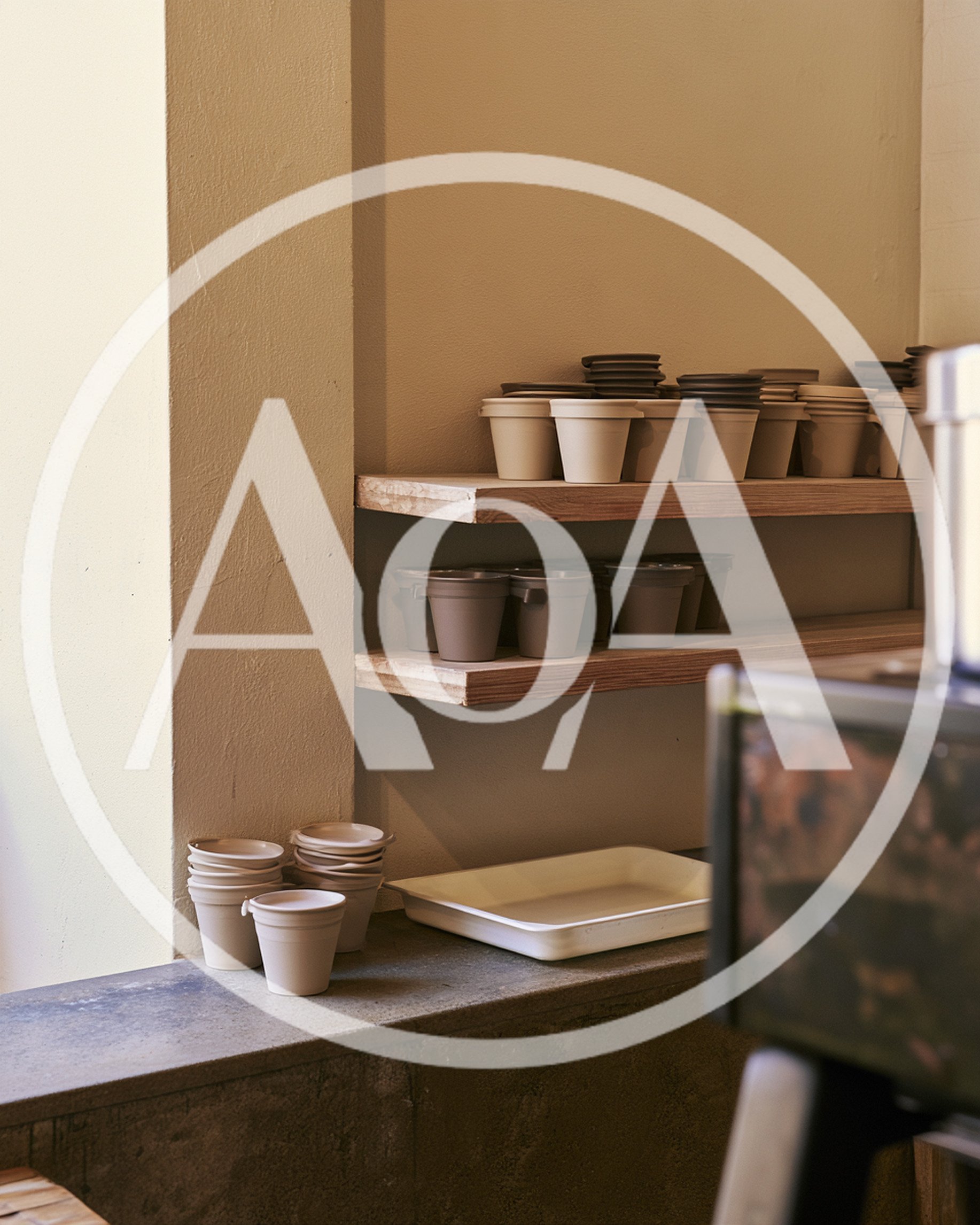 Stacked Ceramic Cups On Wooden Shelves In Cafe