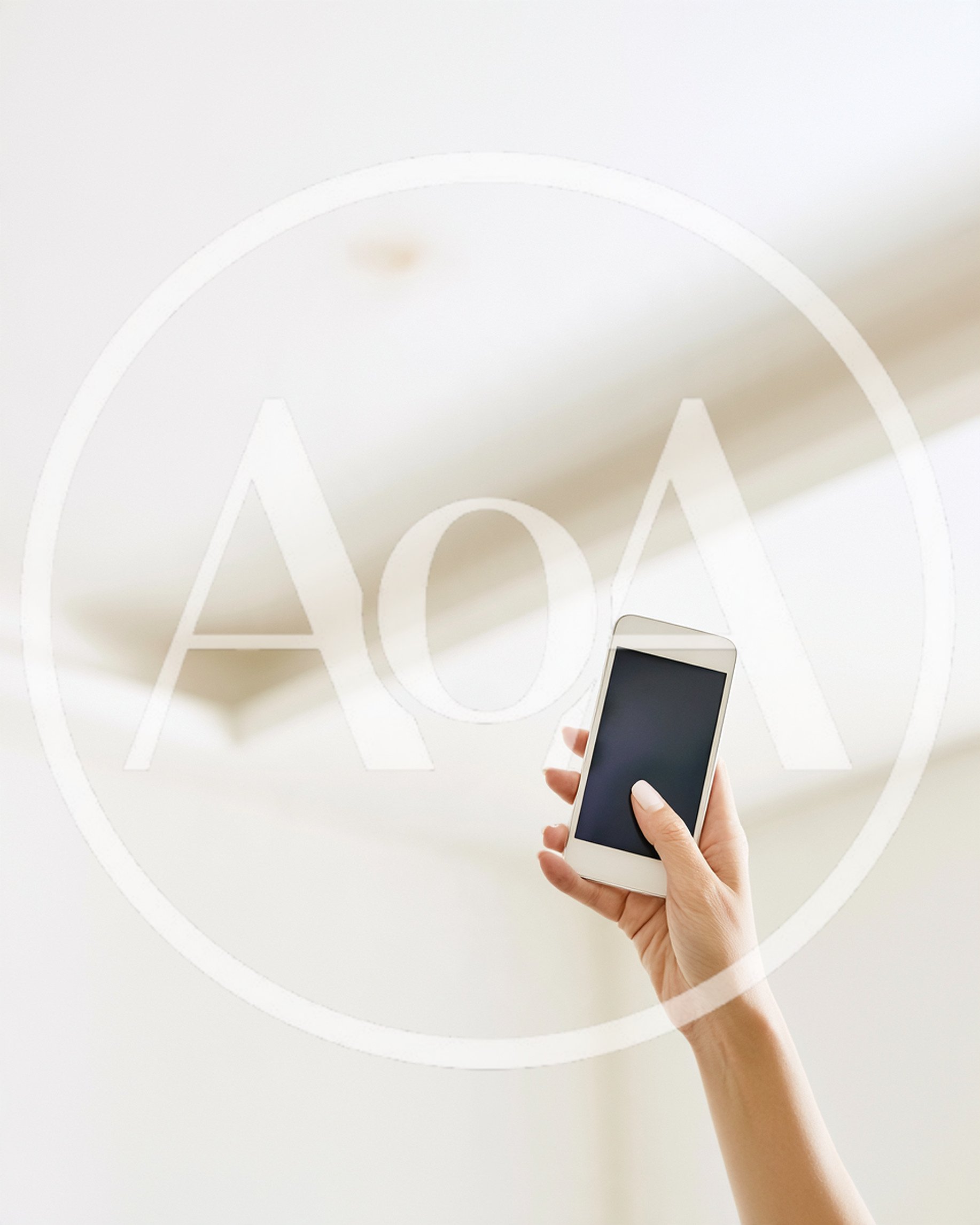 Hand Holding Smartphone Against Bright Minimalist Background