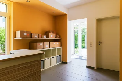 Modern Office Reception Area With Cardboard Shipping Boxes