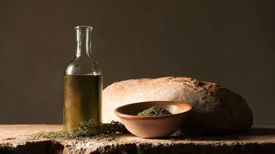 Rustic Still Life With Bread Olive Oil And Herbs