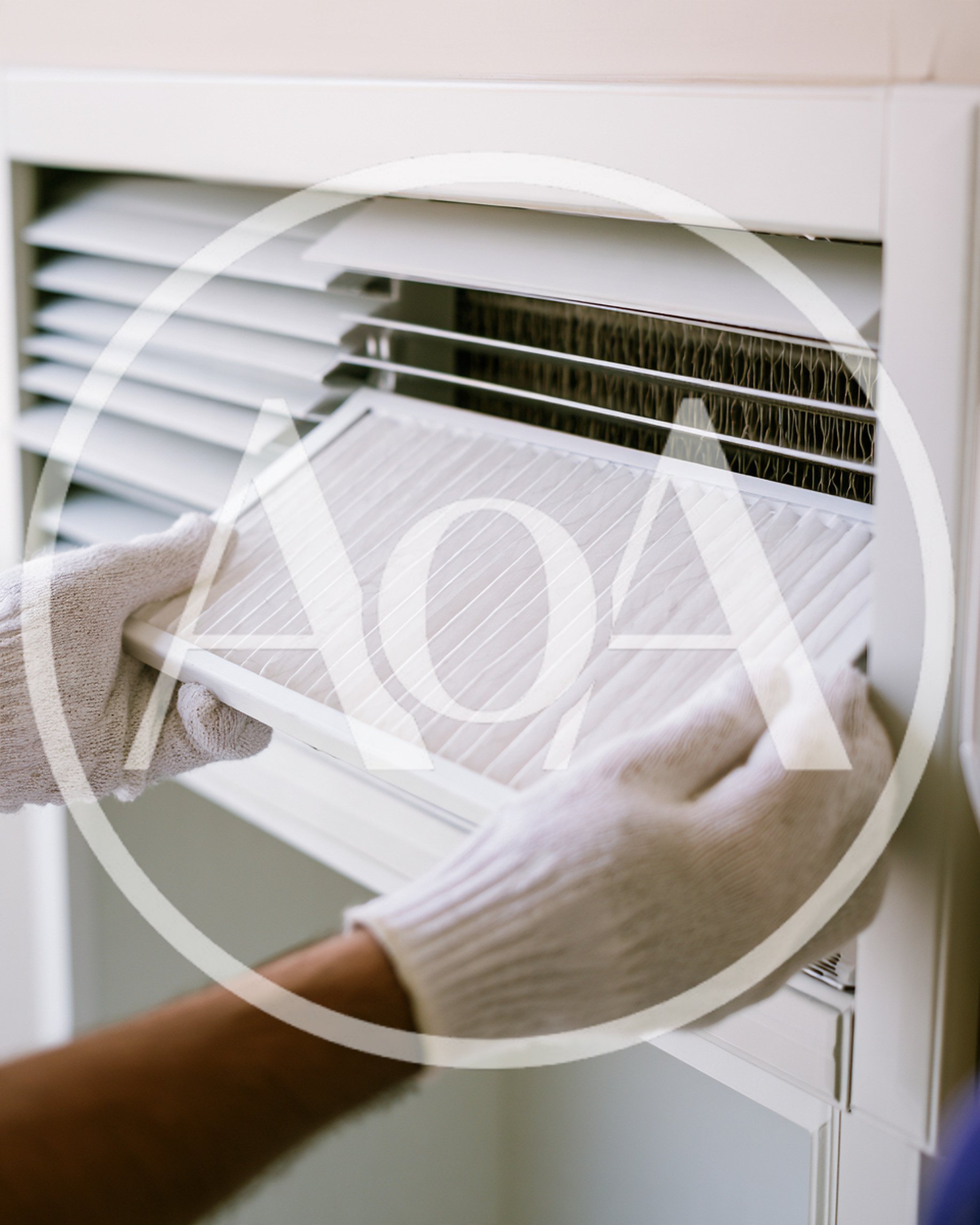 Technician Replacing Air Conditioner Filter