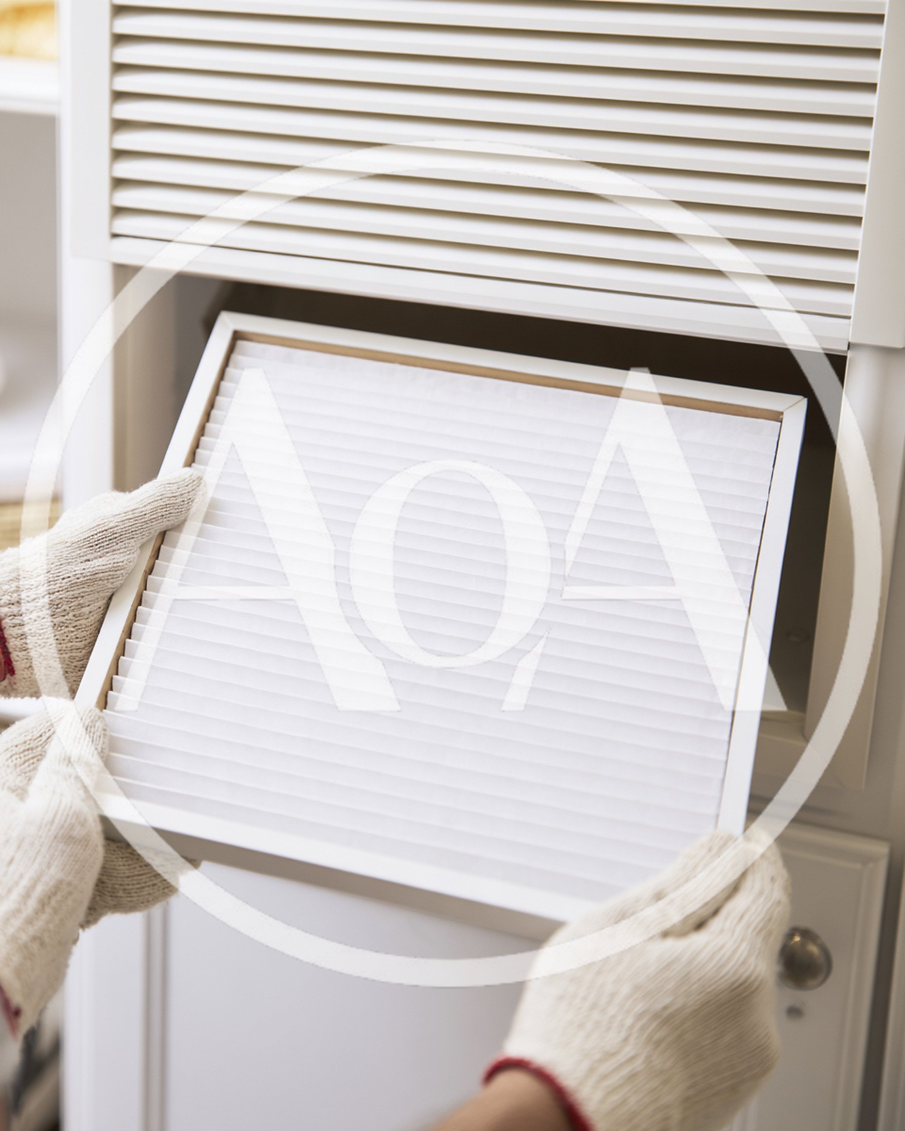 Person Replacing Air Filter In Home HVAC System