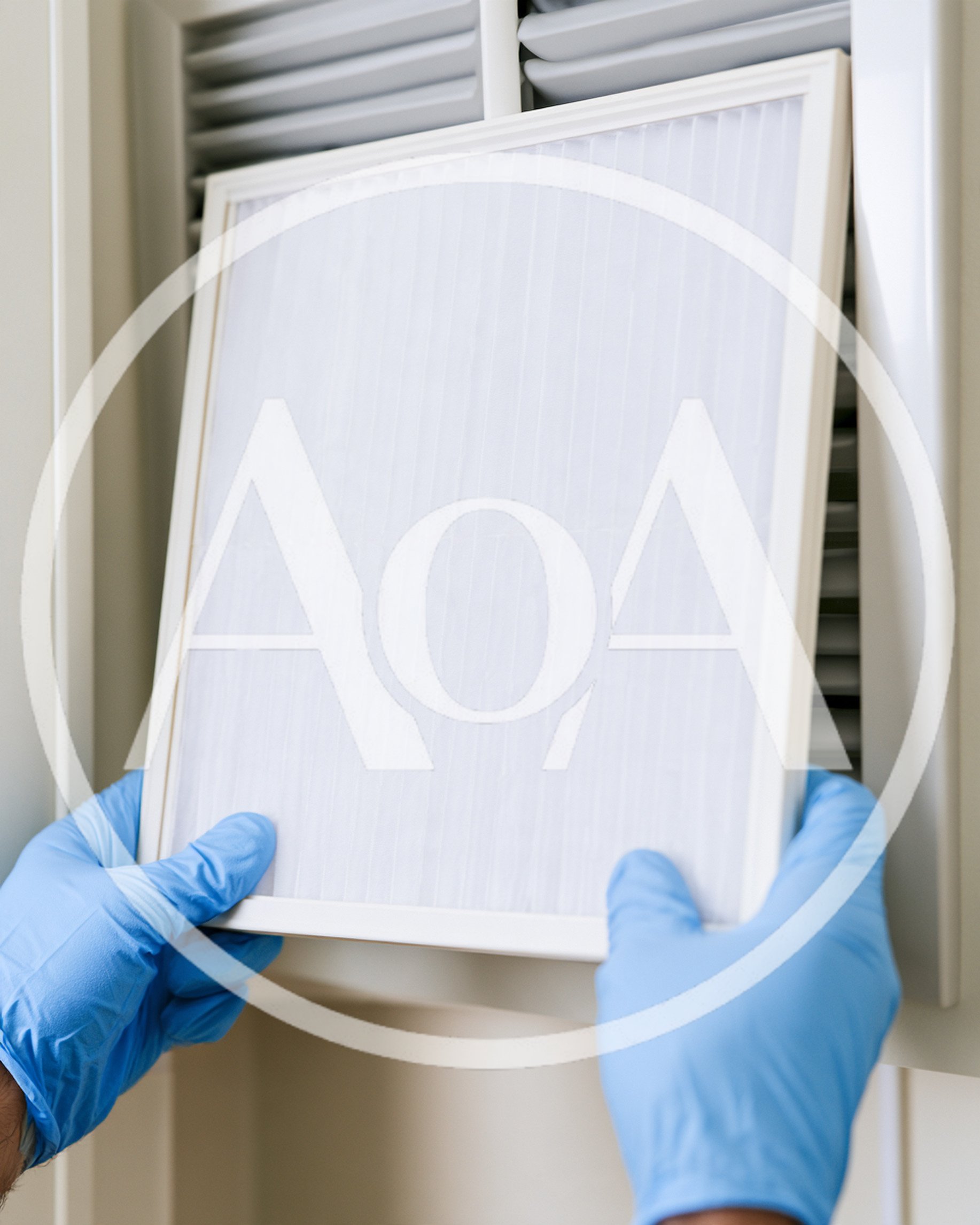 Technician Replacing Air Conditioner Filter