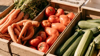 Fresh Organic Vegetables In Wooden Crates At Market