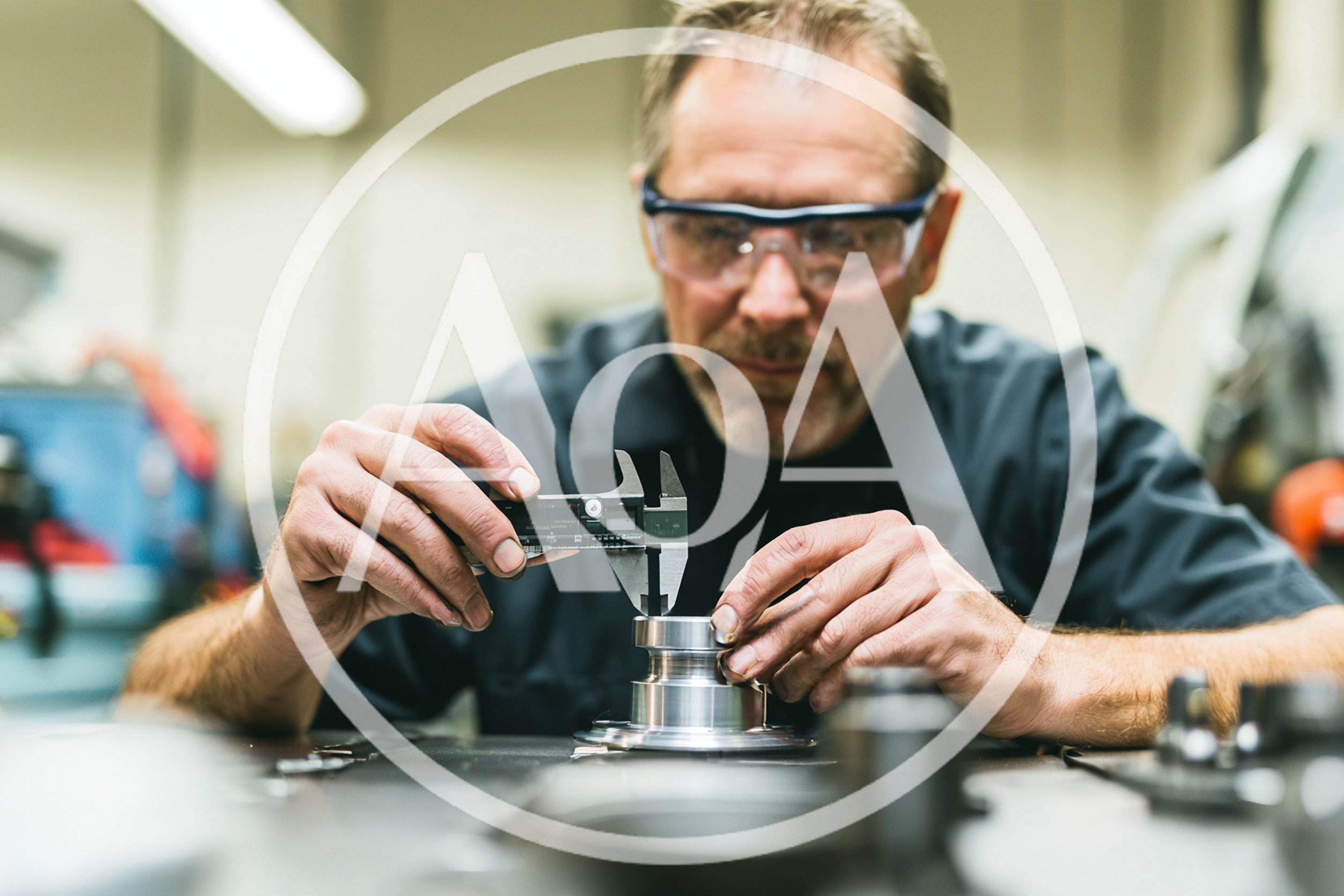 Machinist Measuring Metal Part With Digital Calipers