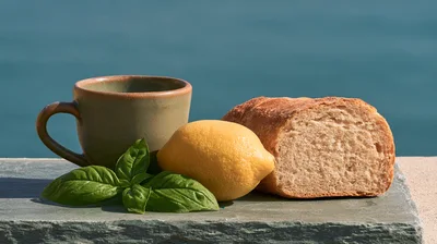 Still Life With Bread Lemon Basil And Coffee Cup
