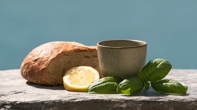 Rustic Bread Lemon and Basil on Stone Surface