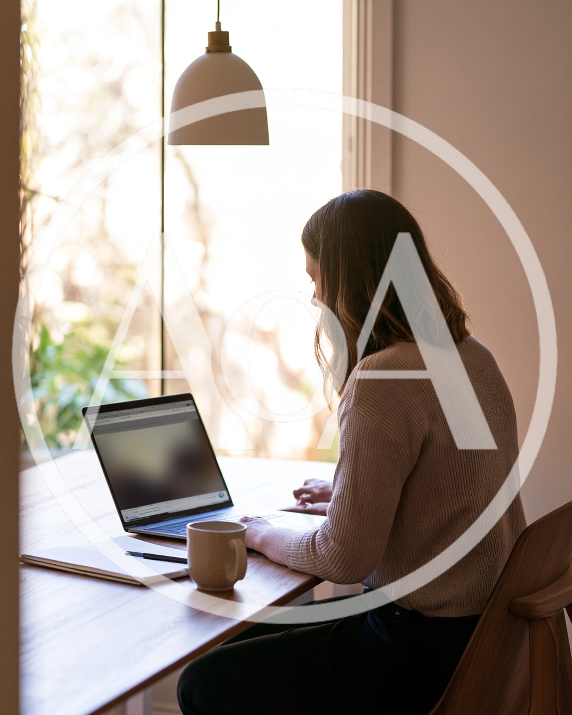 Woman Working On Laptop At Home Office Desk