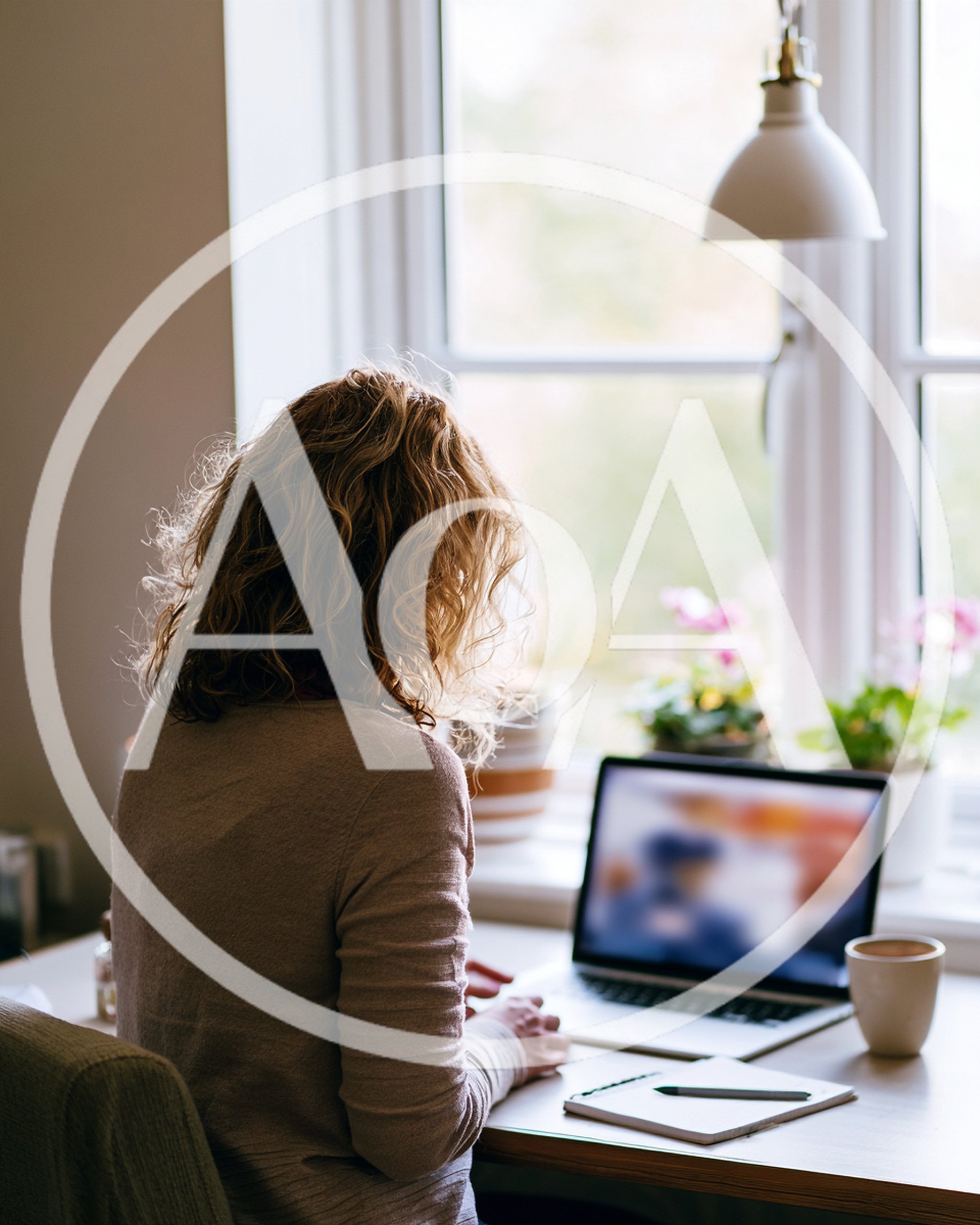 Woman Working On Laptop At Home Office Desk