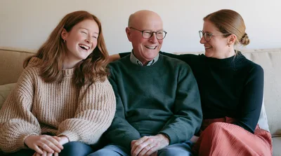 Happy Family Sitting Together On A Sofa