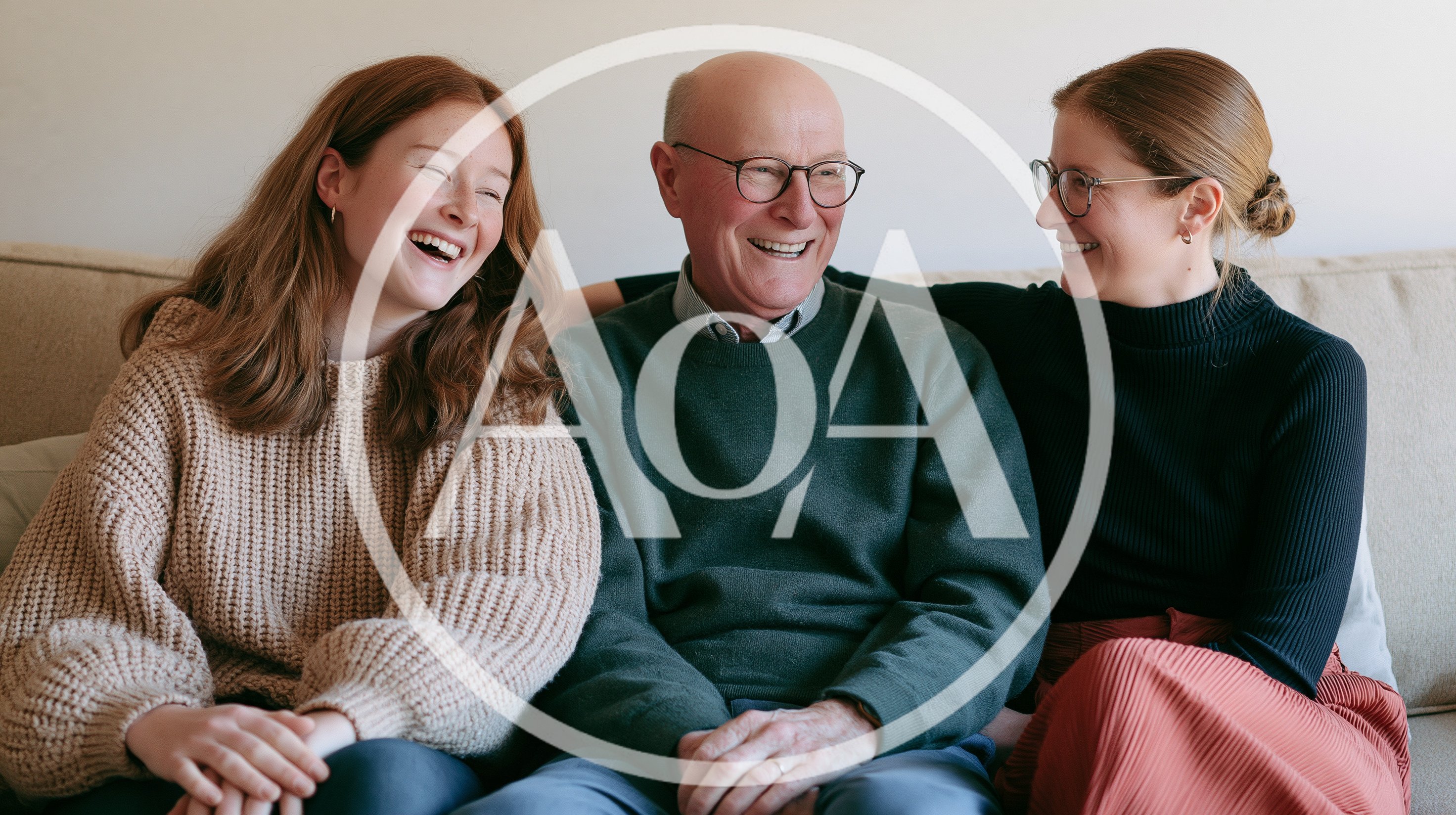 Happy Family Sitting Together On A Sofa