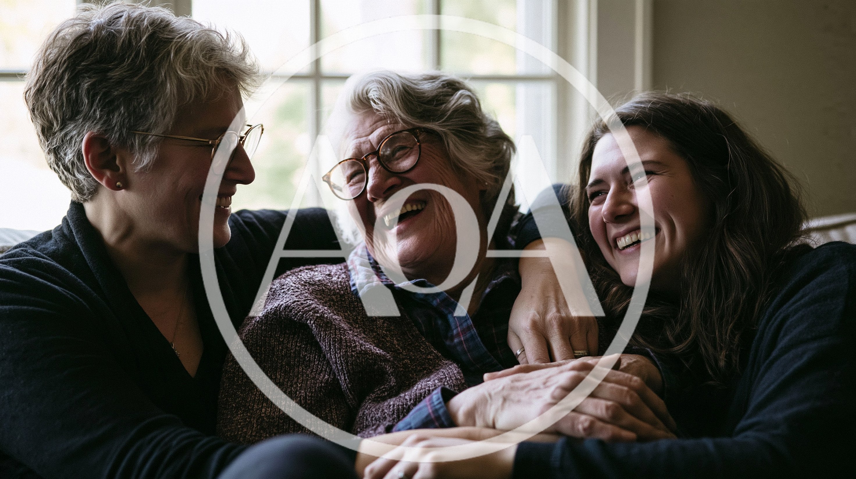 Three Generations Of Women Laughing Together At Home