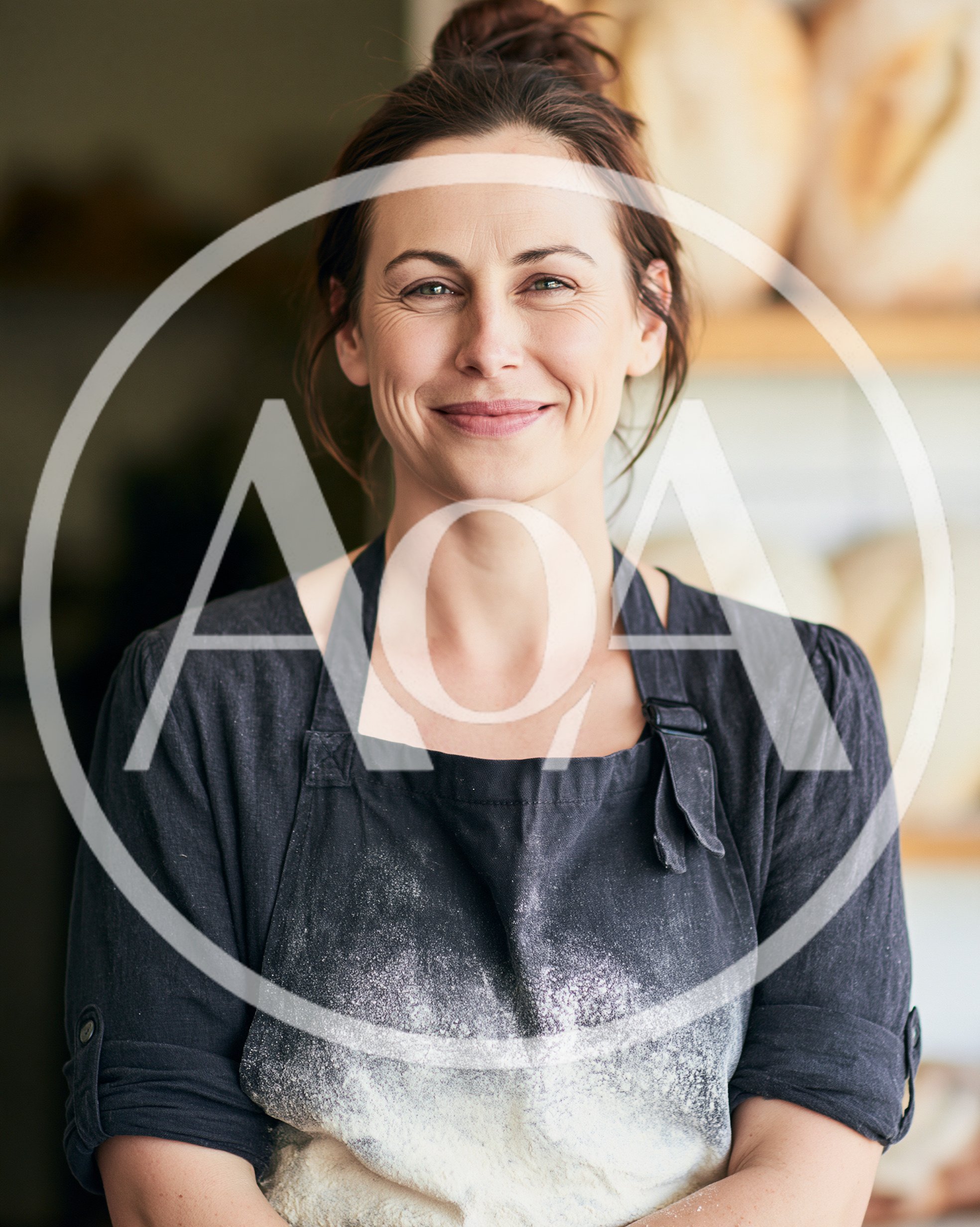 Portrait Of A Smiling Female Baker In A Bakery