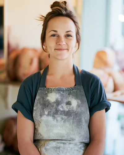 Portrait Of A Female Baker In A Floury Apron