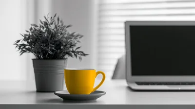 Yellow Coffee Cup On A Desk With Laptop