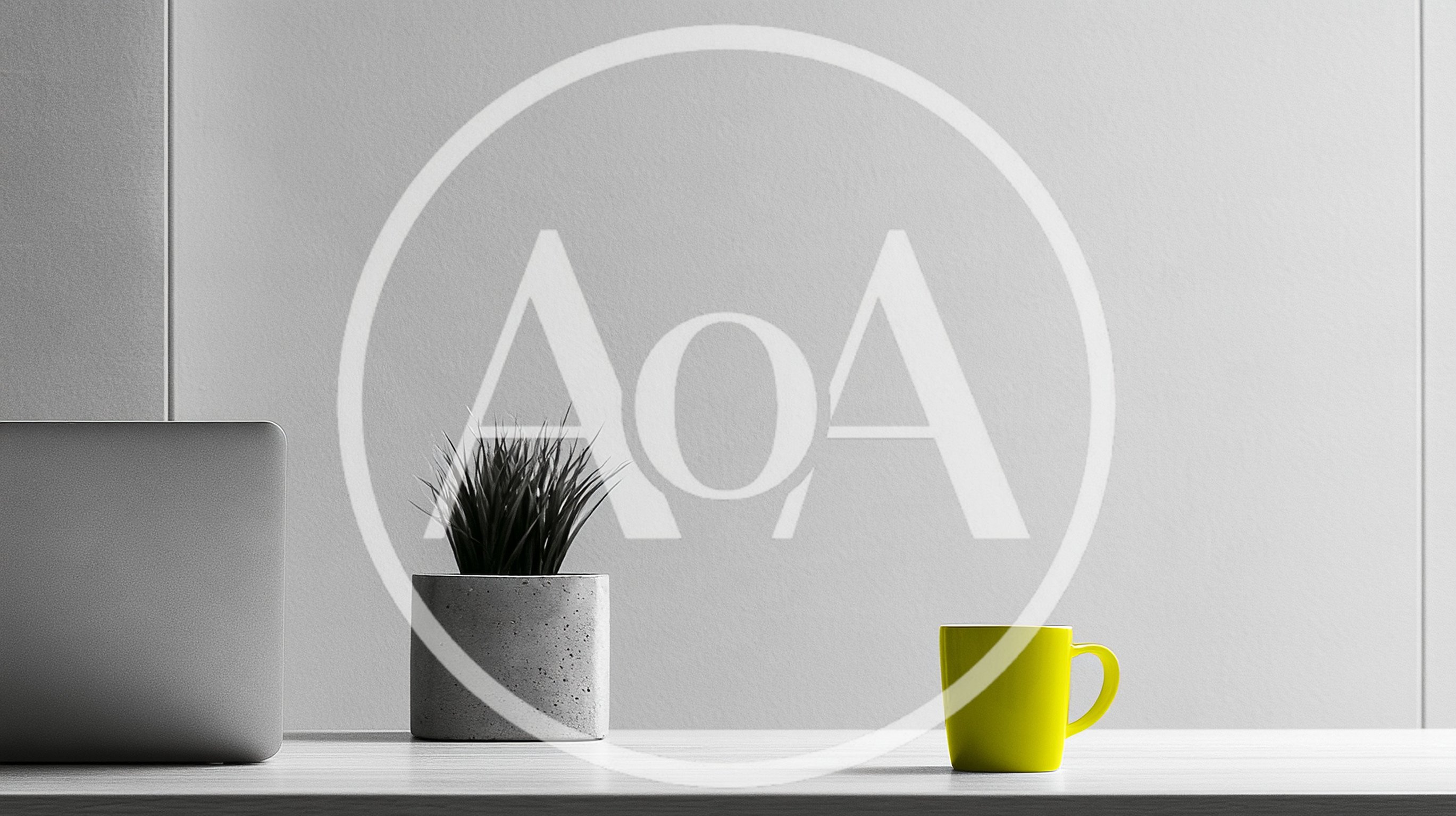 Minimalist Desk Setup With Laptop Plant And Yellow Mug