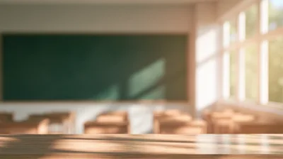 Empty Classroom With Wooden Desk In Foreground
