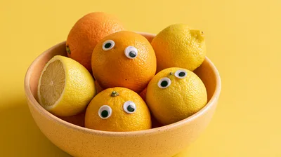 Googly Eyed Citrus Fruits In A Bowl