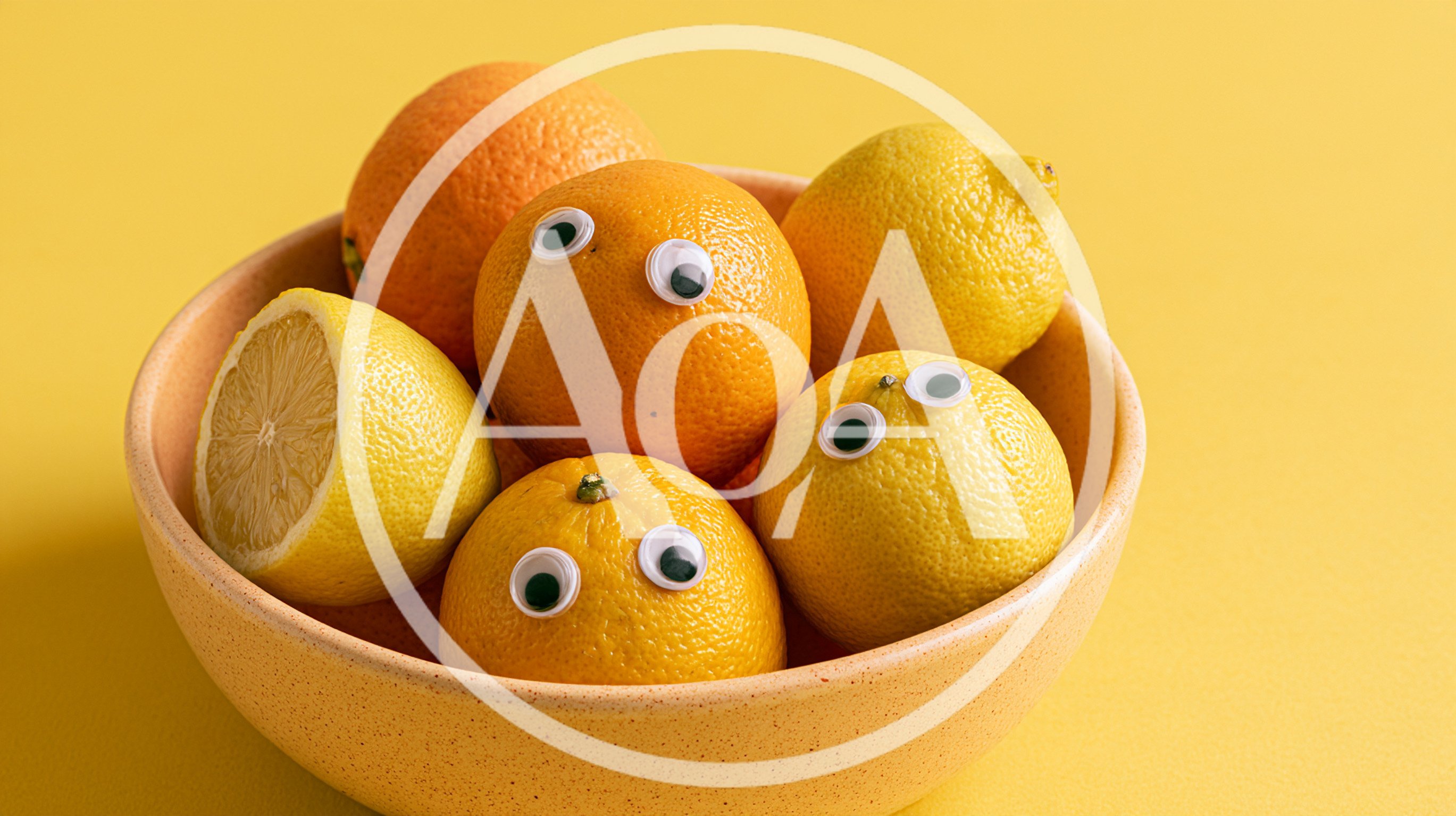 Googly Eyed Citrus Fruits In A Bowl
