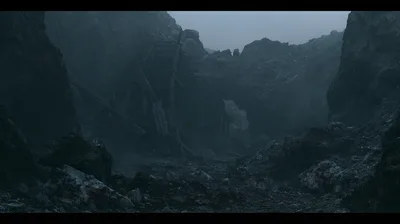 Dilapidated Wooden Mine Structure In A Dark Rocky Canyon
