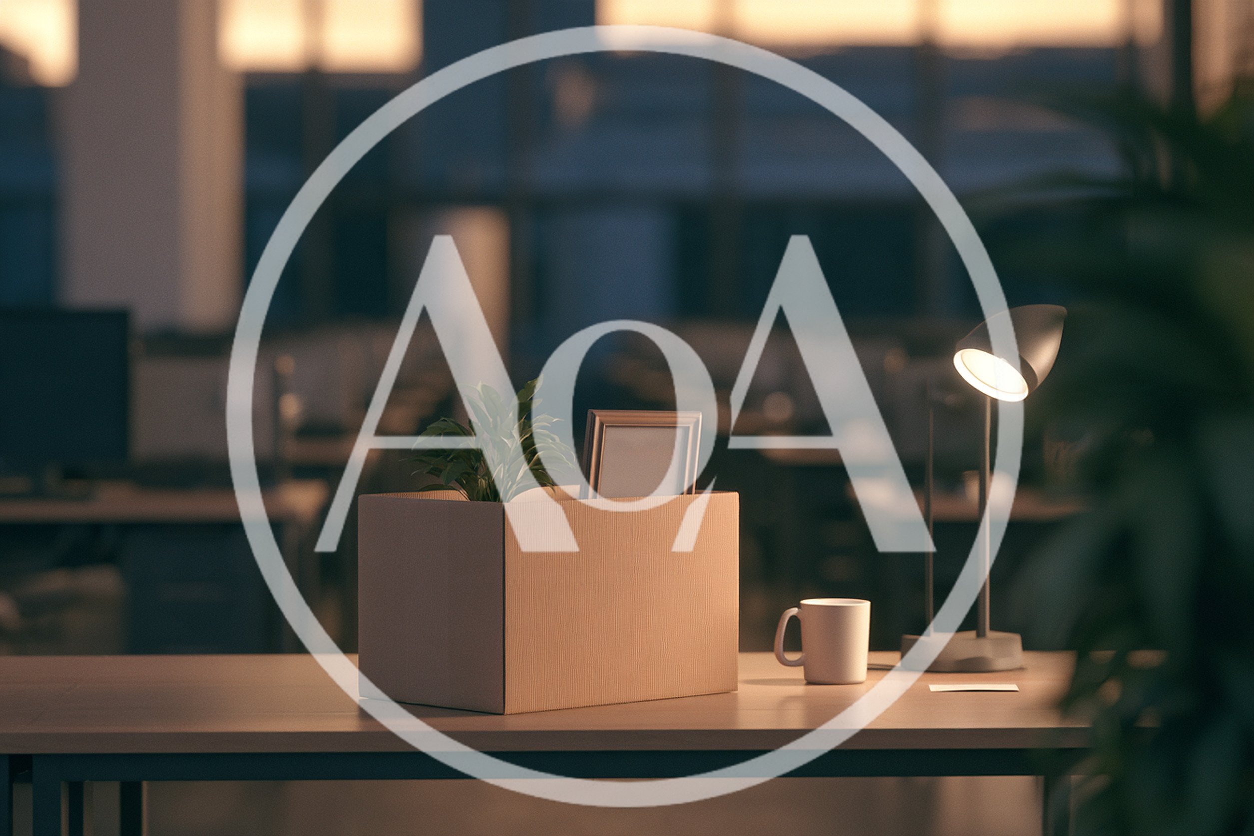 Cardboard Box With Personal Belongings On Office Desk