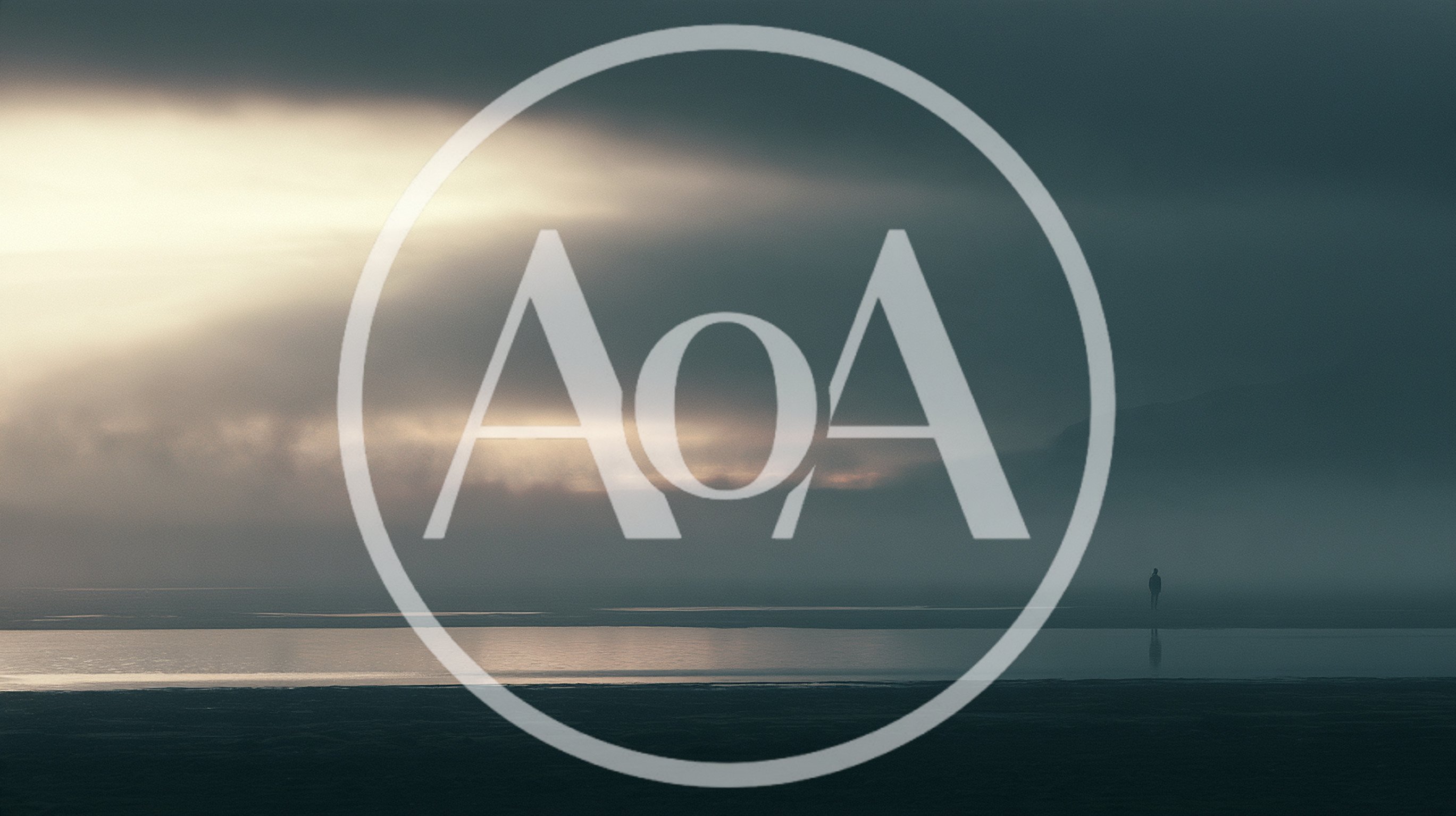 Lone Person Standing On A Misty Beach At Twilight