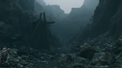 Dark Abandoned Mine Entrance In Foggy Mountain Pass