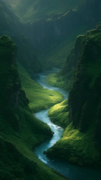 Aerial View Of A Winding River In A Green Canyon