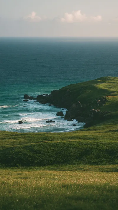Rolling Green Coastal Hills Overlooking The Pacific Ocean