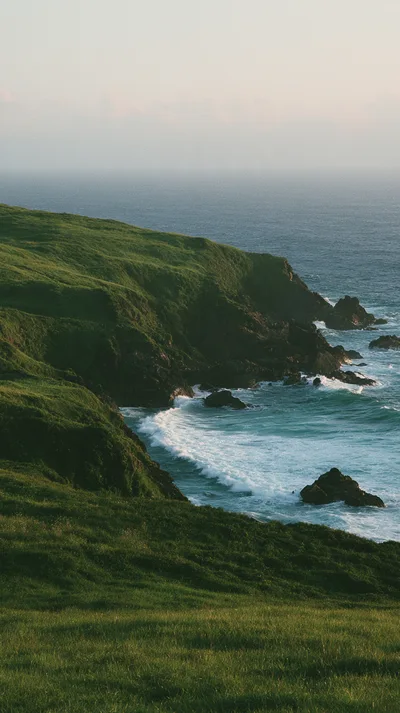 Green Coastal Cliffs Overlooking The Atlantic Ocean