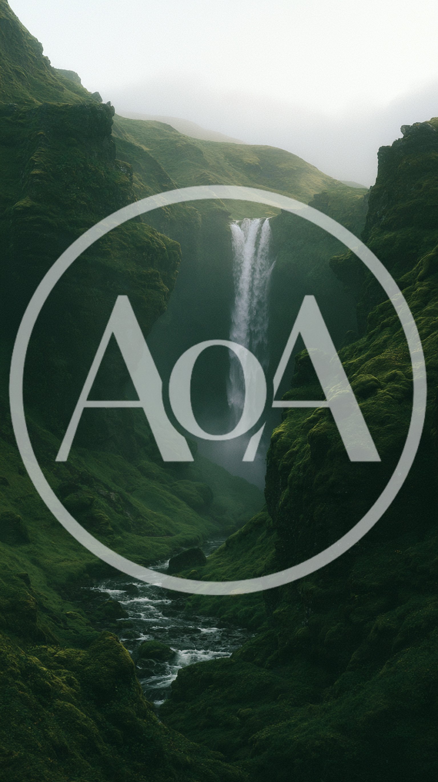 Majestic Waterfall Flowing Through A Lush Green Mossy Canyon