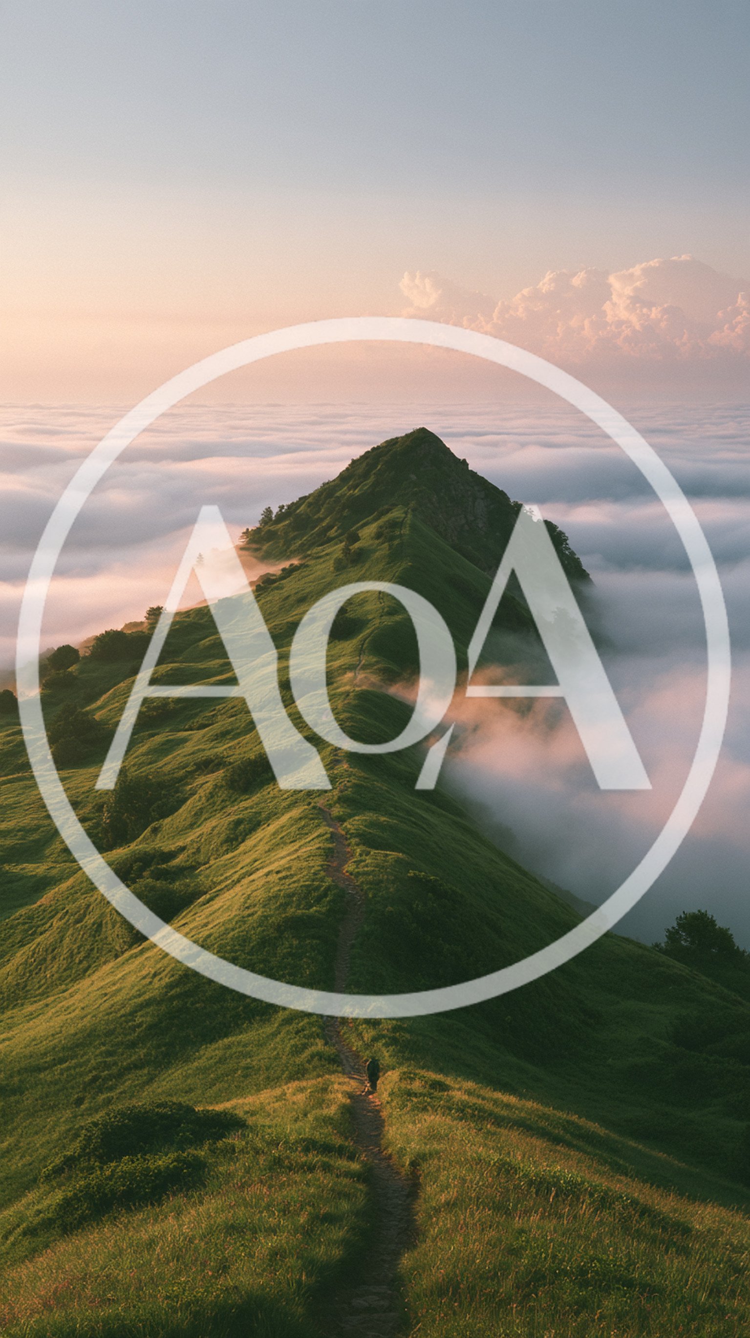Hiker Walking Along A Grassy Mountain Ridge Above Clouds