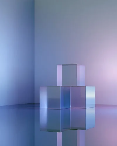 Three Transparent Glass Cubes On Reflective Surface