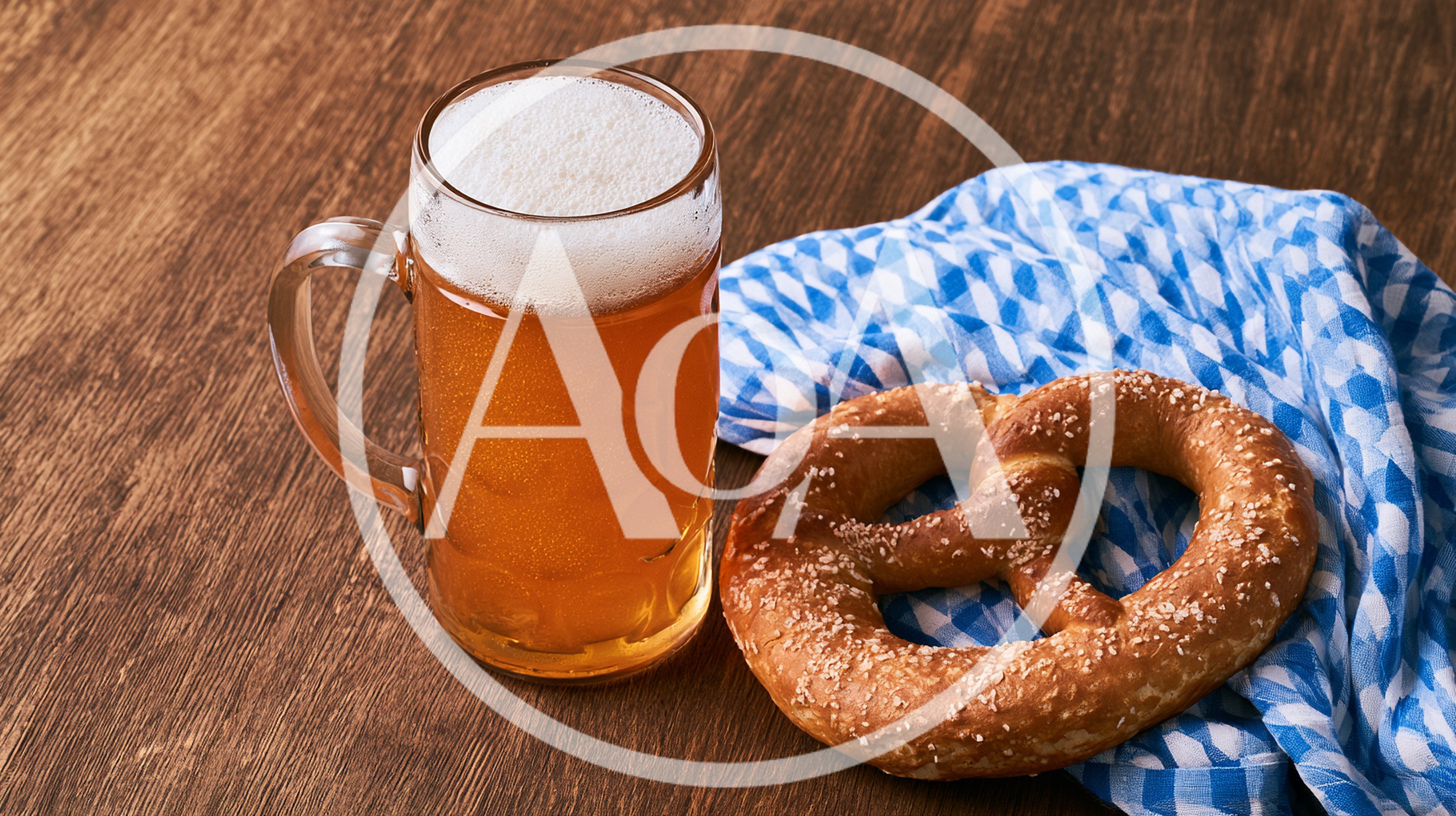 Bavarian Beer Mug And Salted Pretzel On Wooden Table