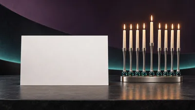 Blank White Card Beside Lit Hanukkah Menorah