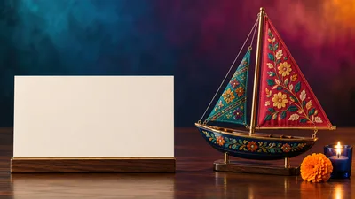 Decorative Sailboat Model With Blank Card On Wooden Table