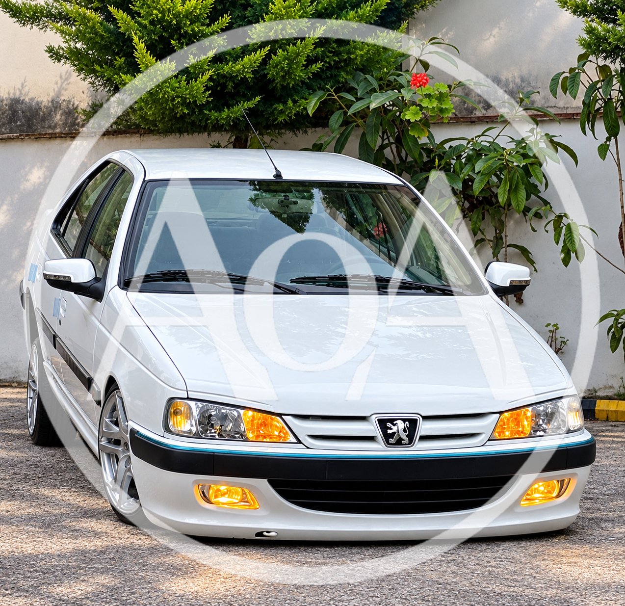 White Peugeot Pars Sedan Parked Outdoors