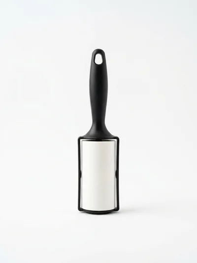 Lint Roller With Adhesive Paper On White Background