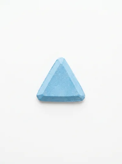 Single Blue Triangular Piece Of Sidewalk Chalk