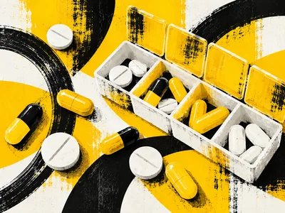 Pill Organizer With Assorted Medication On Abstract Background