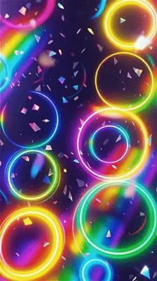 Neon Rainbow Rings Floating Over Dark Background