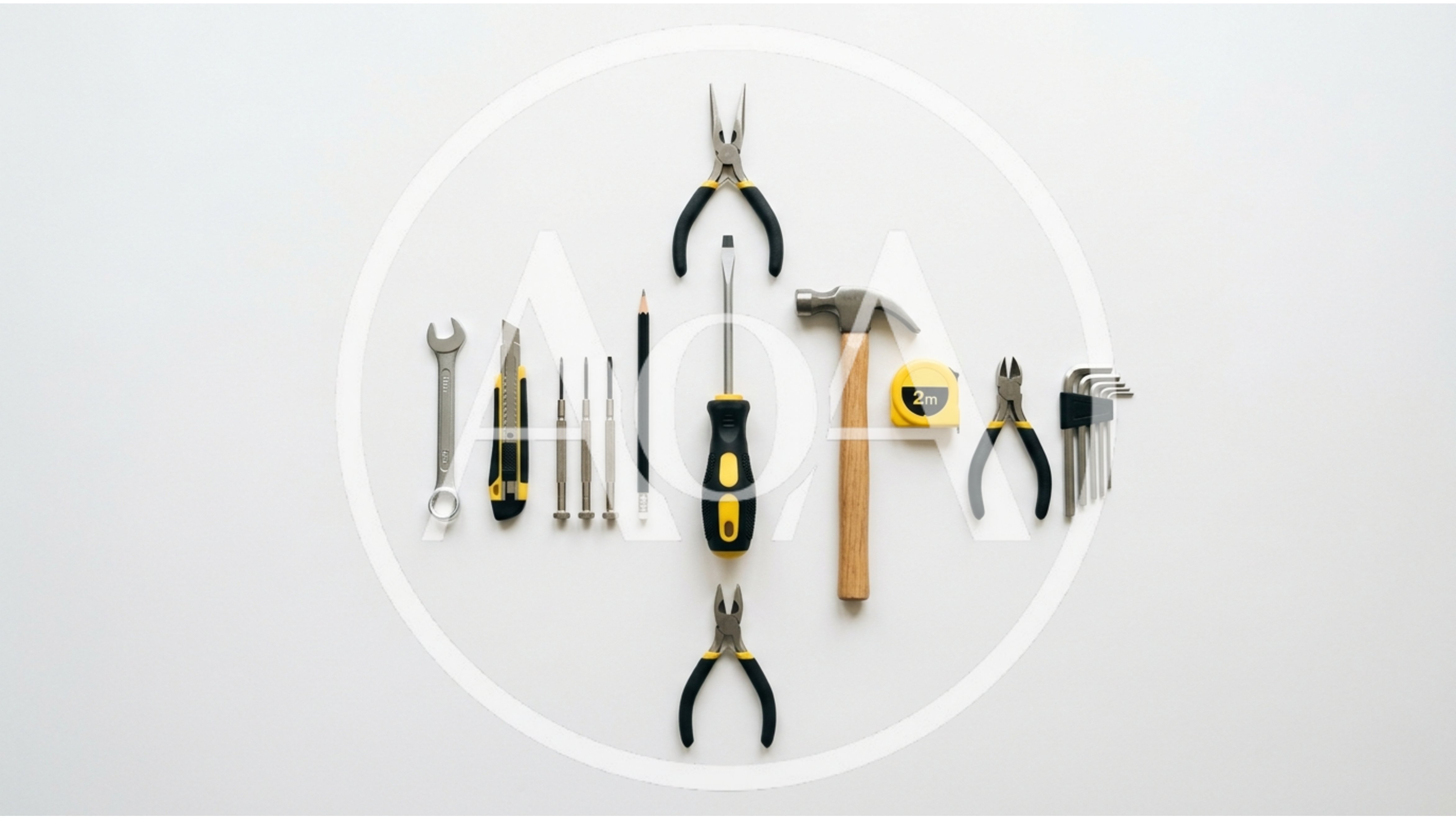 Assorted Hand Tools Arranged On White Background
